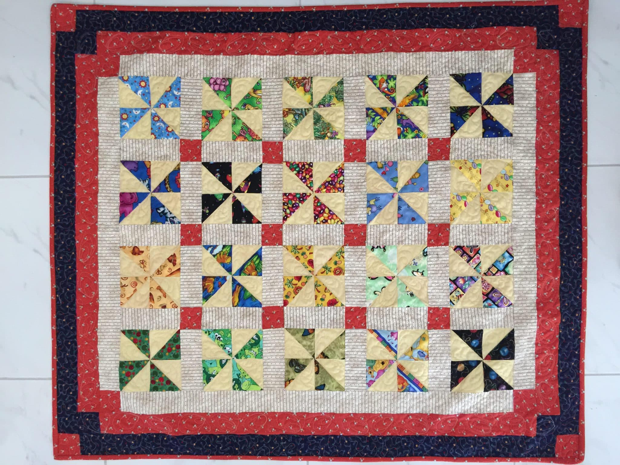 I Spy Pinwheel Quilt | susies-scraps.com