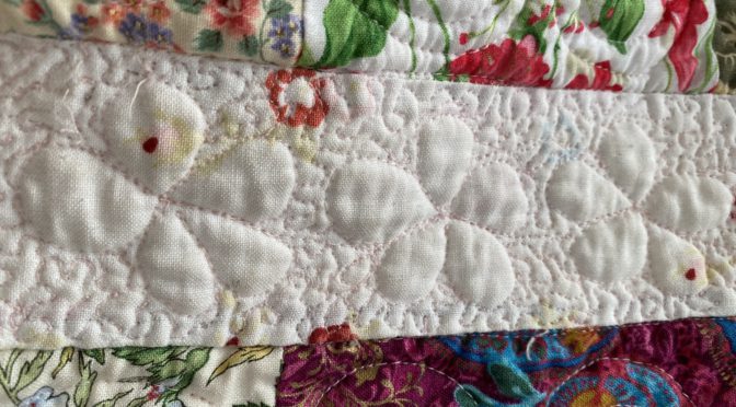 Free motion quilting puffed daisies